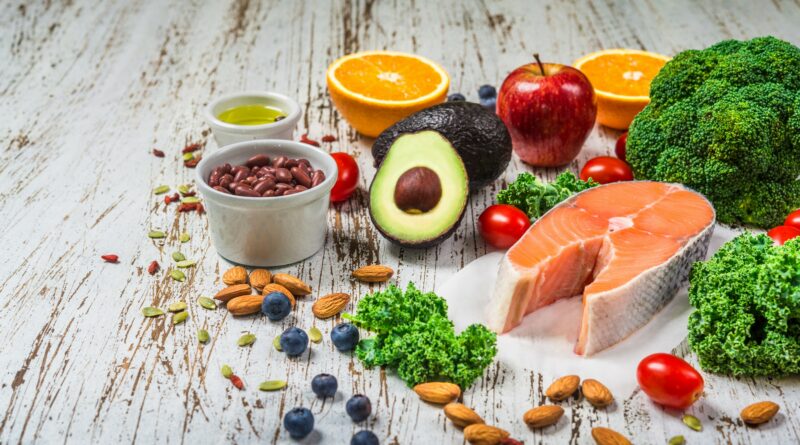 Selection of fresh fruit and vegetables, salmon, beans, and nuts. Concept of cooking and eating healthy food, fitness, dieting, vegetarian, and lifestyle. Ingredients good for heart and diabetes.